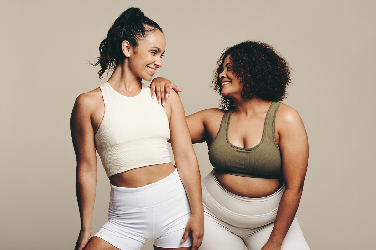 two women smile at each other after getting medical weight loss in San Antonio